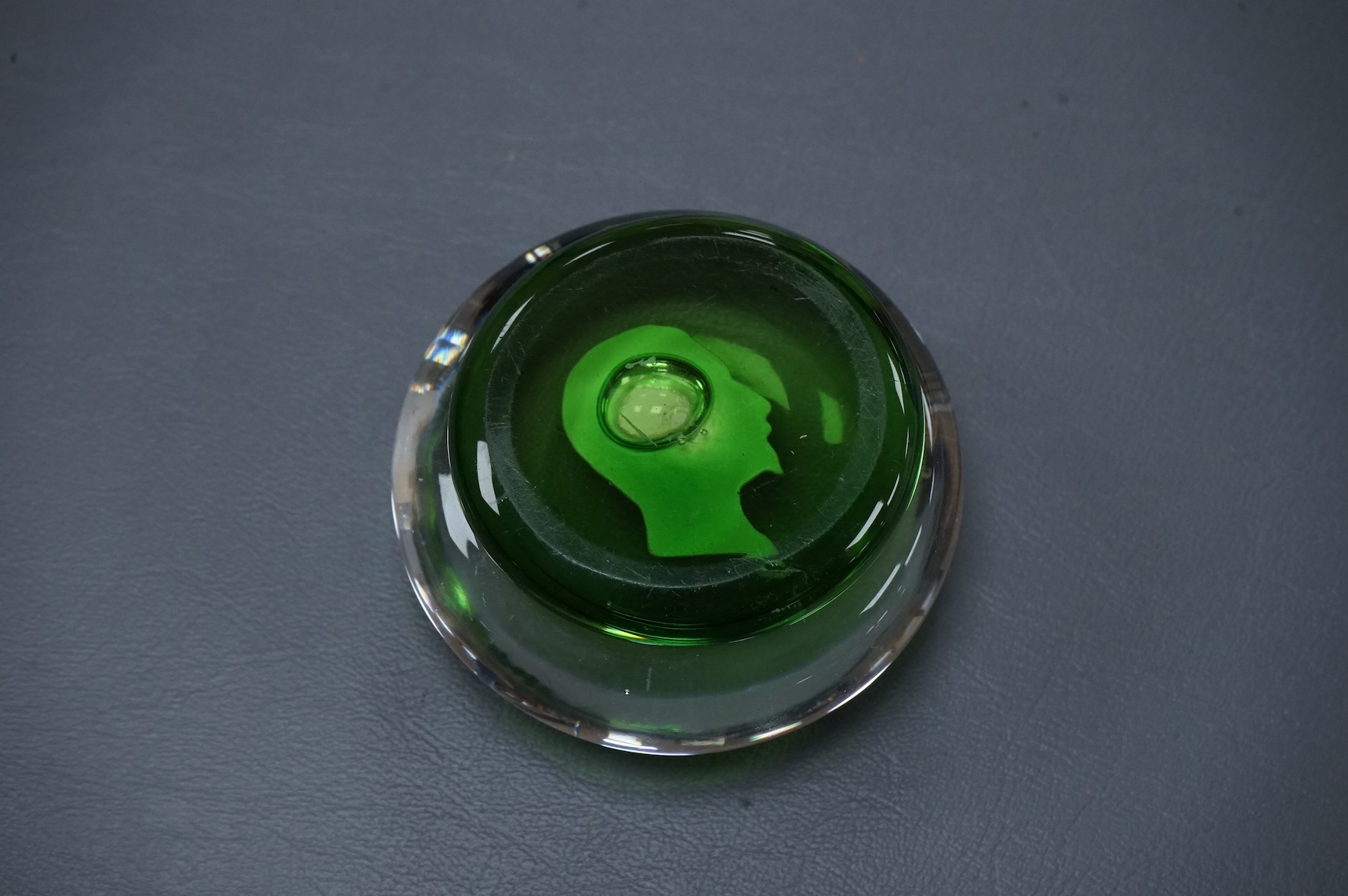 A Clichy Napoleon III sulphide paperweight, green pedestal foot. base 6cm diameter.